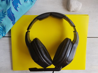 headphones on yellow background, holidays concept