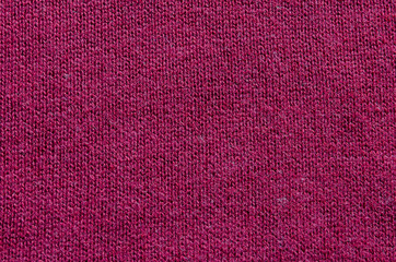 Backgrounds and textures. Maroon knitted fabric. Fine knit.