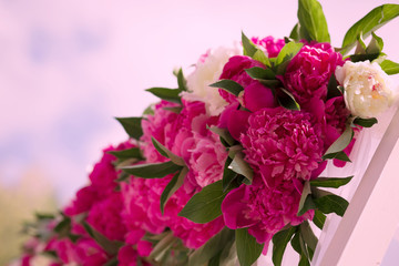 Part of the wedding arch with pink and white flowers, peonies