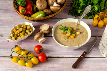 The mushroom soup in a blue bowl close-up
