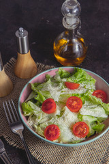Salad, parmesan and tomatoes.