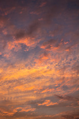 Small clouds of pink and orange colors at dawn.