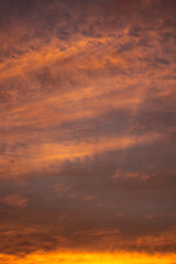 Small clouds of pink and orange colors at dawn.