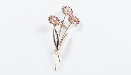Beautiful floral brooch on white background