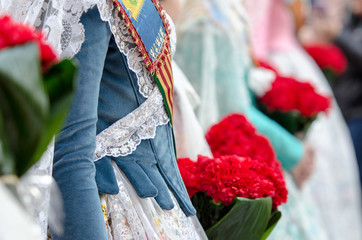 Flowers for the Virgin in the offering of the fallas of Valencia. Falleras dress