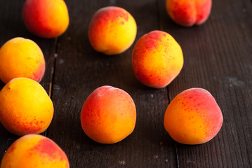 peaches on black wood table