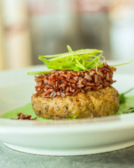 wild rice with meat and green sauce (main dish, portion). food background. copy space