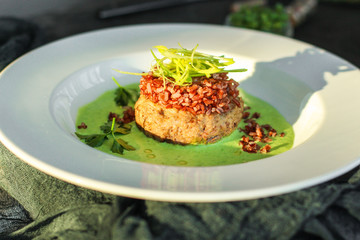 wild rice with meat and green sauce (main dish, portion). food background. copy space