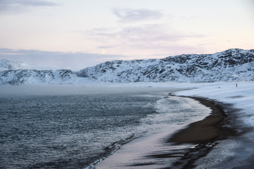 Fototapeta na wymiar arctic ocean white snow beach waves