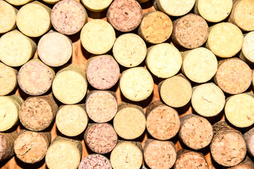 many old wine corks stand on wooden background top  pattern
