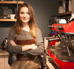 Fototapeta na wymiar woman using coffee machine