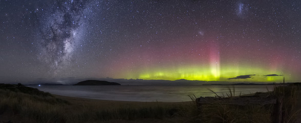 Beautiful display of the Aurora Australis or Southern Lights with the galactic centre of the Milky Way