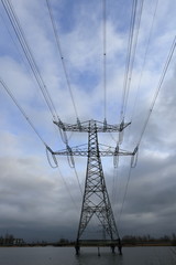 Electricity pylon standing in water