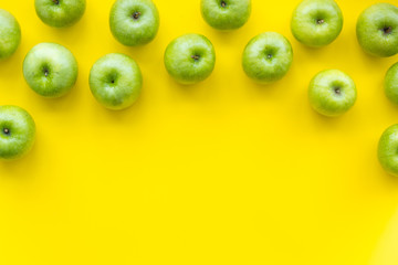 food pattern with green apples on yellow background top view space for text