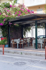 Wooden tables and chairs of a street restaurant