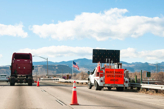 Road Crew Working On A Busy Freeway