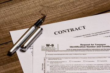 IRS form W-9 and a contract