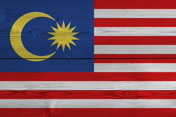 Malaysia flag painted on old wood plank