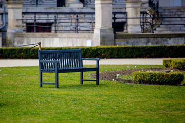 Fototapeta na wymiar Bench in French style in a park.