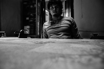 Fototapeta na wymiar Self portrait, man waiting for his food, table, kitchen and food