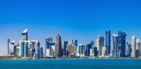 The morning panoramic view of the skyscrapers of Doha from the Persian Gulf. Futuristic skyline in the financial district of Qatar