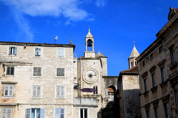 Fototapeta na wymiar Historic buildings in Split, Croatia with landmark city clock. Split is popular coastal travel destination.