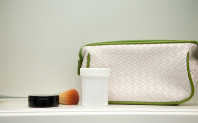 White medicine bottle and bag in cabinet