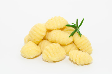 Uncooked fresh homemade gnocchi isolated on white background. Italian cuisine - raw gnocchi, made of potato, flour and egg on white.     
