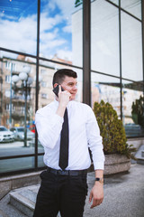 Smart businessman well dressed talking on the phone