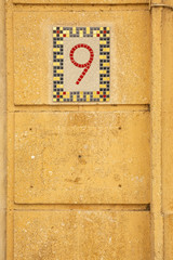 Mosaic street number sign in Arles, France