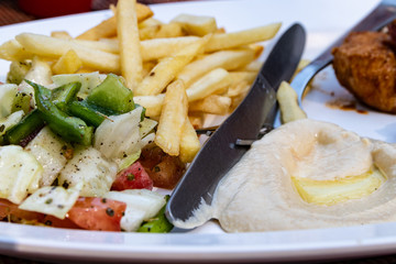 chicken with french fries and vegetables
