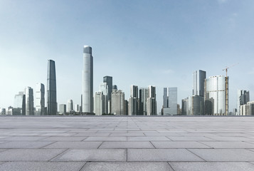 Obraz premium empty brick floor and cityscape of modern city nea