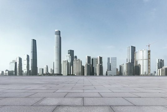 empty brick floor and cityscape of modern city nea