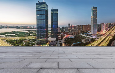 empty brick floor and cityscape of modern city nea