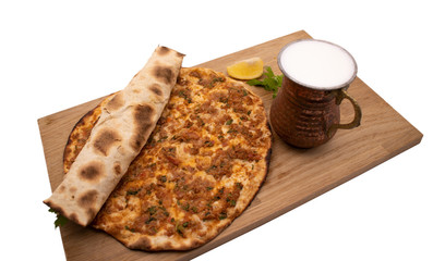 Turkish pizza, lahmacun, isolated on white background. lahmacun on a wooden table. Horizontal. one rolled with fresh garnish on the white surface.Cold buttermilk (ayran) near it.Close up taken,isolate