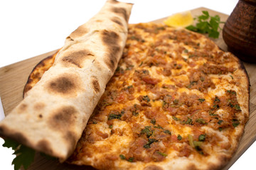 Turkish pizza, lahmacun, isolated on white background. lahmacun on a wooden table. Horizontal. one rolled with fresh garnish on the white surface.Cold buttermilk (ayran) near it.Close up taken,isolate