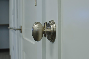 A nickel style oval knob on the new show room wall on display. 