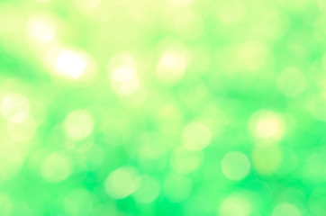 Green bio background, abstract blurred foliage bright sunlight. Organic design nature abstract background with copyspace for text advertising design.  Green abstract light background and bokeh effect