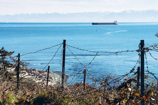 Barb wire on a cargo ship background