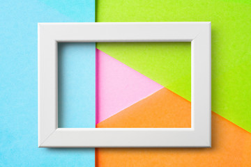 white frame with pink play button shape
