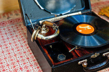 Vintage phonograph with a record disk