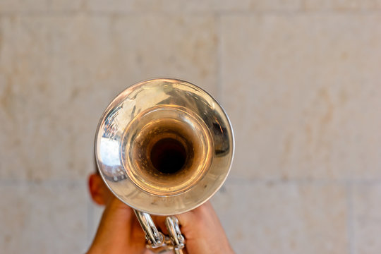 Unrecognizable musician plays trumpet