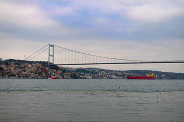 Ships passing through the Bosphorus. Ships passing under the Bosphorus and Fatih Sultan Mehmet Bridge.