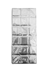Dark chocolate bar in foil isolated on white background. Chocolate wrapped in aluminum foil on bright tablecloth