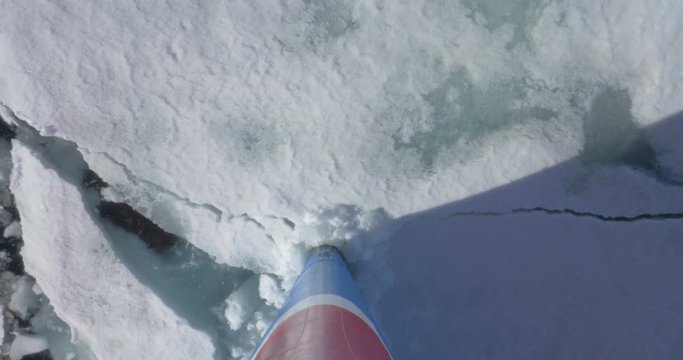 Prow Ship breaks ice in the sea of Spitsbergen Norway