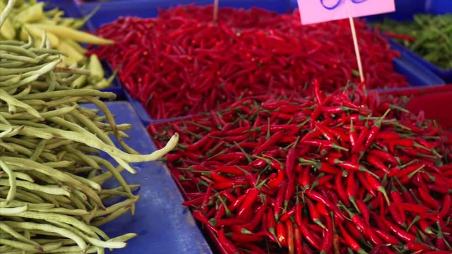 Red peper being sola at a market in Pattaya, Thailan. Assortment of red pepper at a stal at an outdoors market.