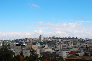 Obraz premium View on the Hebron town from the Metochion of Monastery of the Holy Trinity with the Church of the Holy Forefathers at Abraham's Oak in Hebron