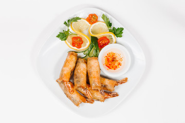 Traditional oriental cuisine of  Vietnam. Pancakes with shrimps on a white background