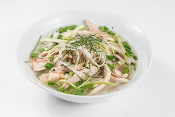 Traditional oriental cuisine of  Vietnam. Pho bo soup with rice noodles, beef, pepper, wheat germ, greens