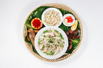 Traditional oriental cuisine of  Vietnam. Pho bo soup with rice noodles, beef, pepper, wheat germ, greens